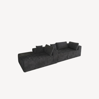 Canapé modulable en velours côtelé gris charbon, méridienne avec coussins.