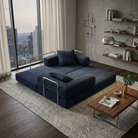 Canapé convertible bleu foncé en velours côtelé, couchage déplié avec coussins.