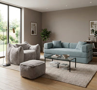 Canapé 2 places modulable - Le Métamorphe- bleu ardoise en velours côtelé, assise large et dossier rembourré, avec le fauteuil Cocoon Gris clair.
