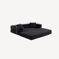 Canapé 2 places modulable velours côtelé noir, configuration banquette avec dossier replié.