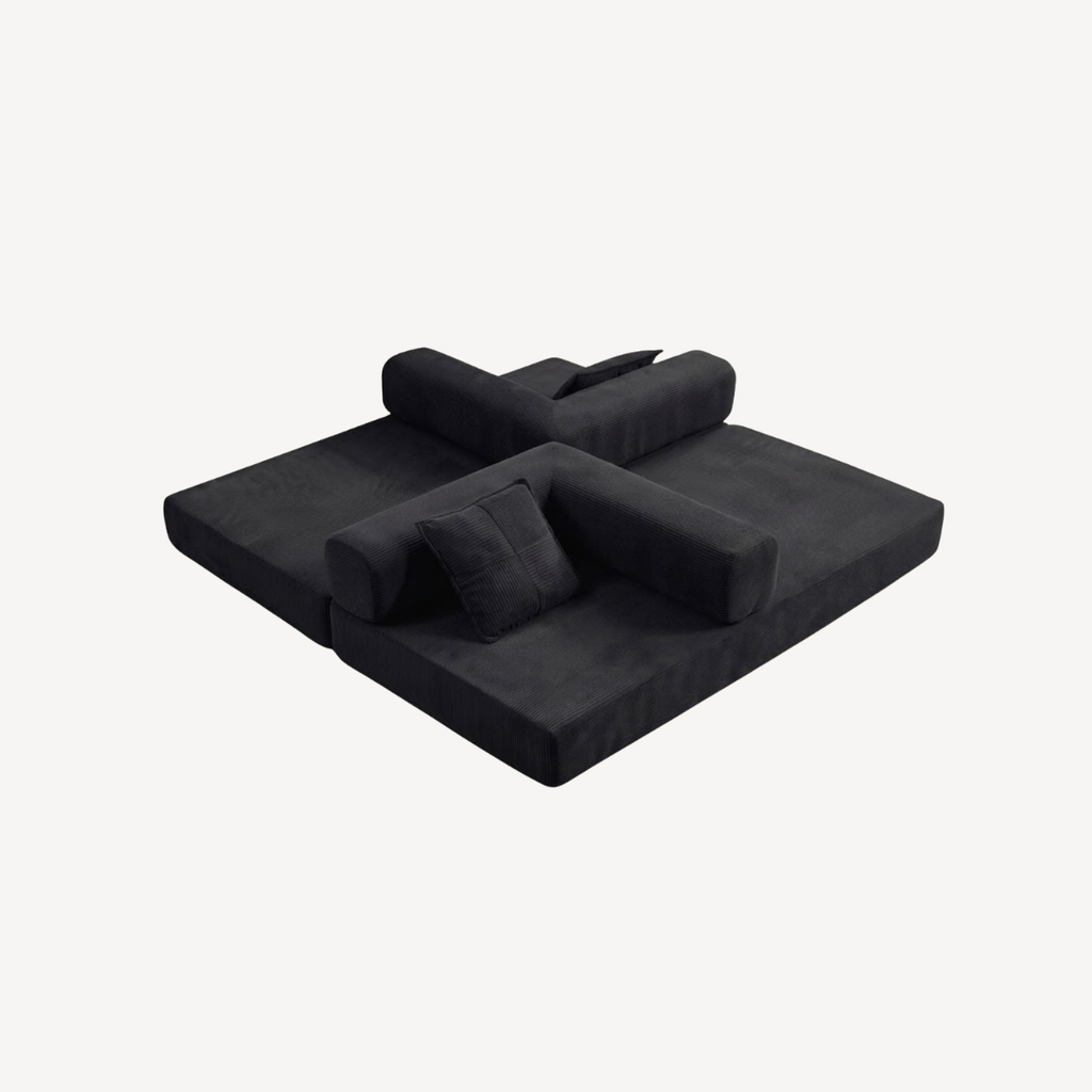 Canapé 2 places modulable velours côtelé noir, assise étendue en position lit.