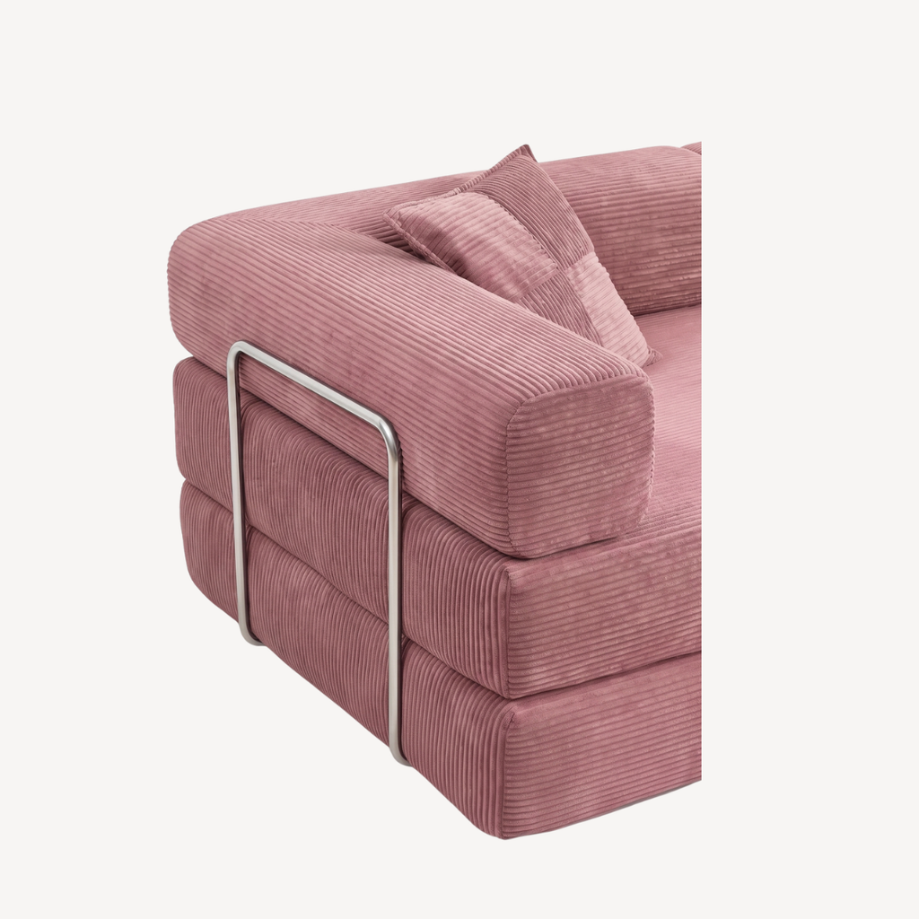 Canapé rose en velours côtelé avec barres métalliques et accoudoirs rembourrés