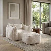Fauteuil cocon en fourrure blanche 1 place avec repose-pied, assise enveloppante.
