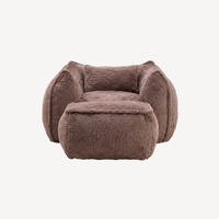Fauteuil 1 place en fourrure marron avec repose-pied, vue de face