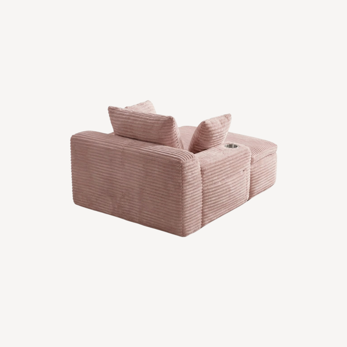 Fauteuil compressé 1 place en velours côtelé rose, vue 3/4 avec coussins roulés.