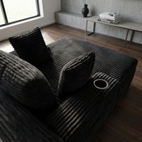 Fauteuil 1 place en velours côtelé noir, dossier capitonné et coussins rayés